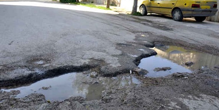  وضعیت نامناسب آسفالت خیابان بنفشه در کوی فرهنگیان اهواز